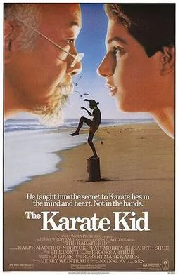 Theatrical poster for The Karate Kid (1984) showing Daniel in the iconic crane-kick pose at sunset.